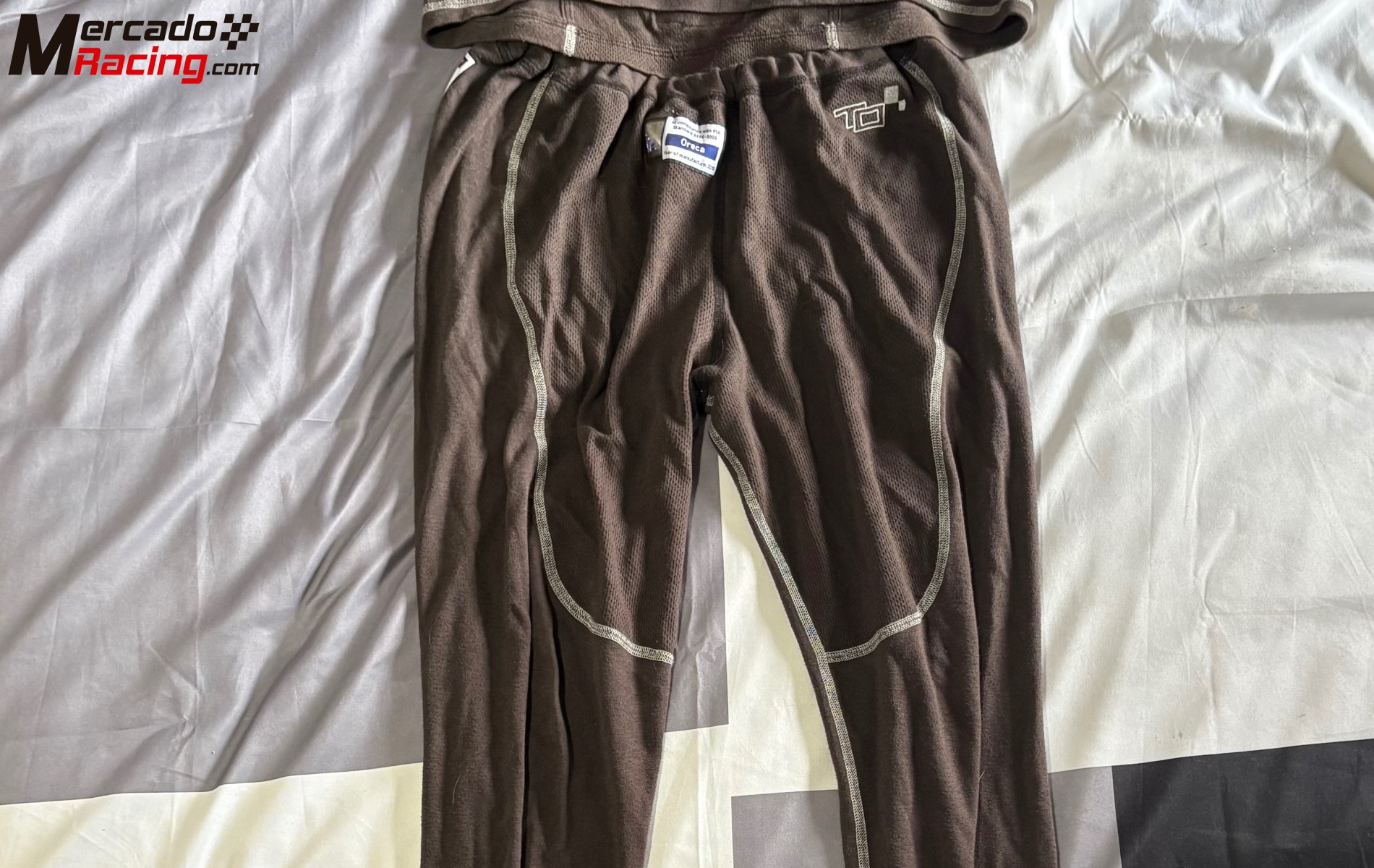 Mono alpinestars y ropa ignífuga oreca