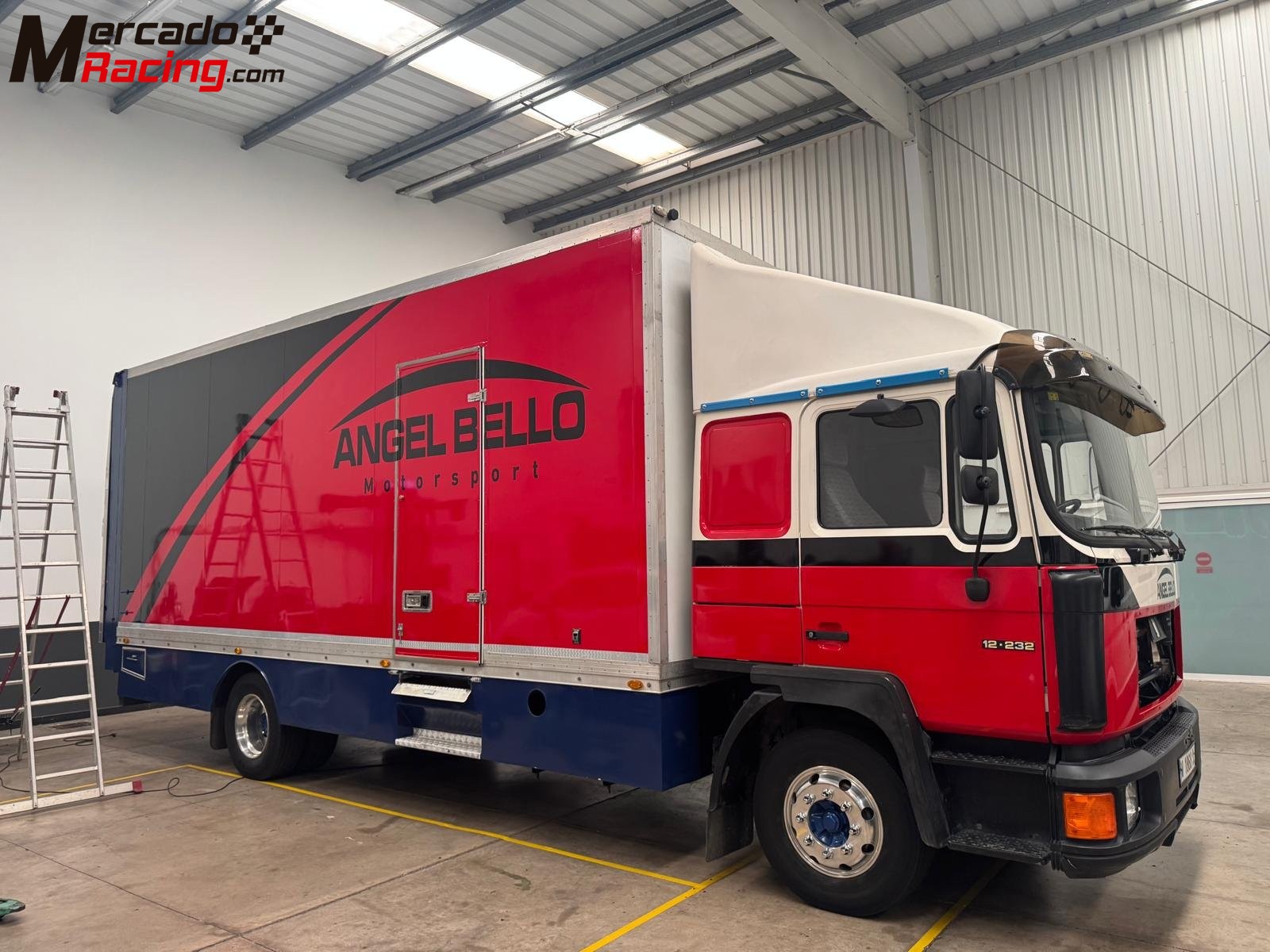 Man 12 232  camion taller con rampa