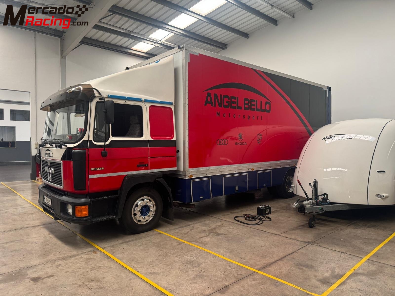 Man 12 232  camion taller con rampa