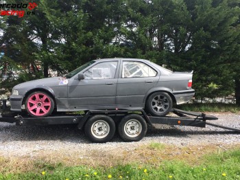 Vendo conjunto de bmw 325i    remolque portavehículos marca 